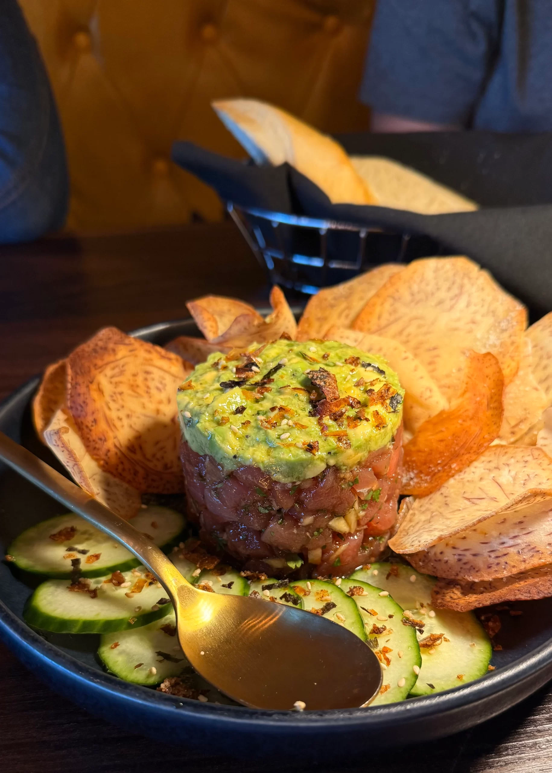 Bruno Tuna Tartare Bruno tuna tartare topped with avocado, served with cucumber and taro chips