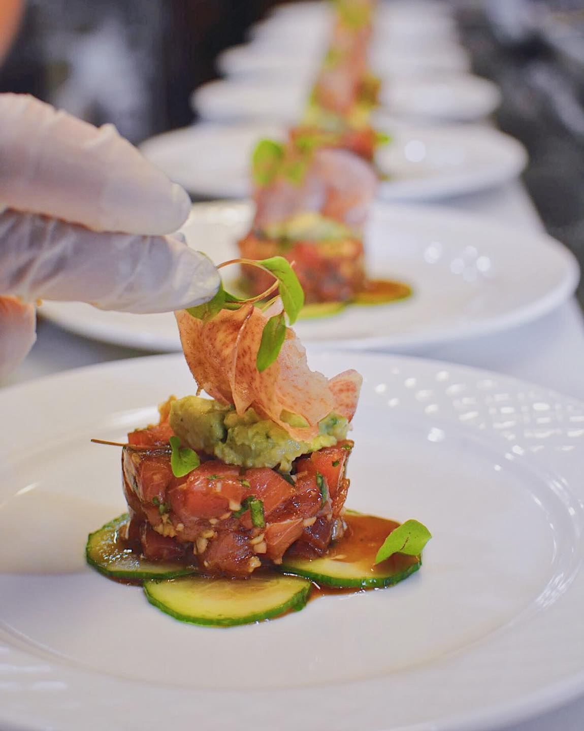 Chef Plating Bruno Tuna Tartare Chef plating Bruno tuna tartare with avocado and cucumber at JC Bruno Restaurant