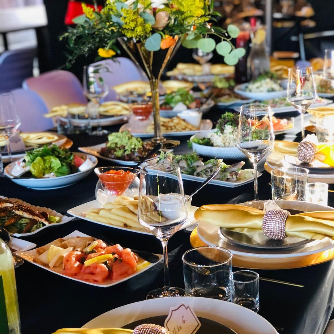 Family-Style Catered Dinner Family-style catered dinner with salads, smoked salmon and a floral centerpiece